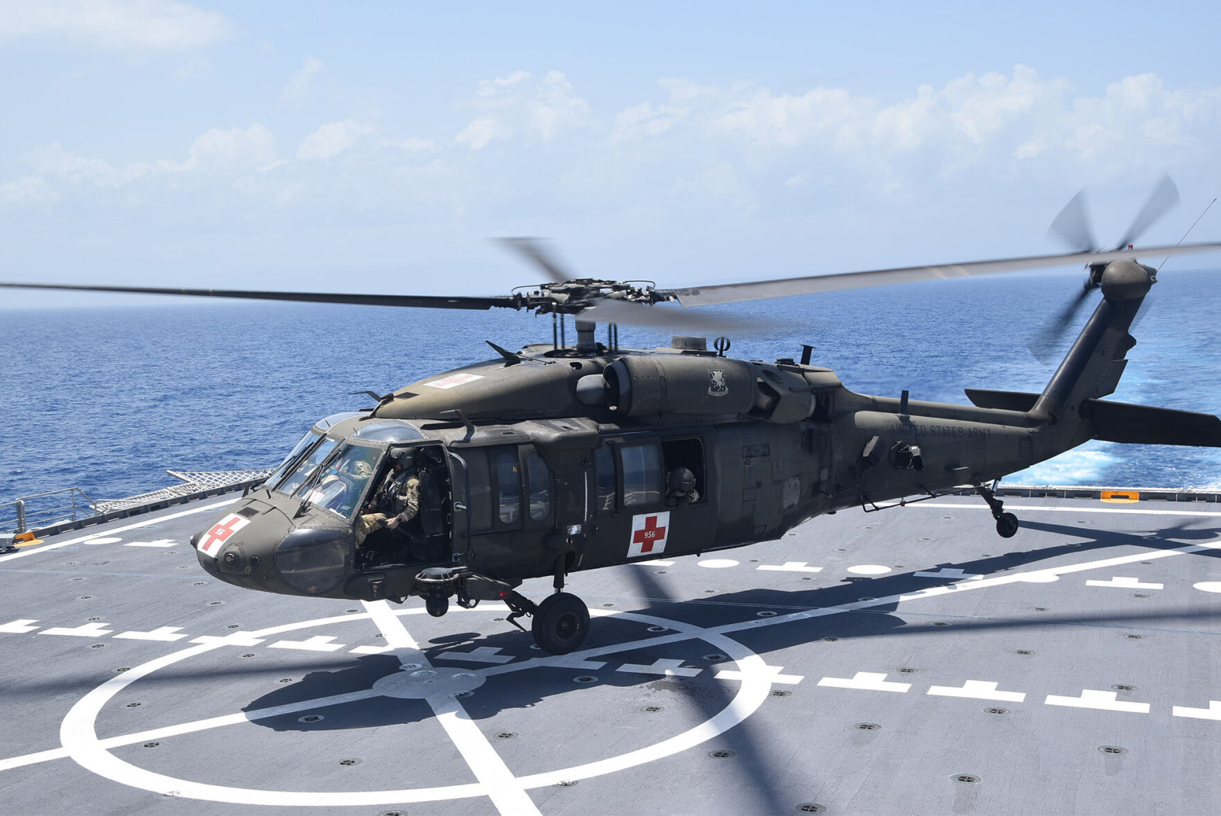 A U.S. Army UH-60 Blackhawk helicopter lands on the fast transport ship USNS Burlington to refuel, Aug. 21, 2021. Burlington is deployed to support humanitarian assistance and disaster relief (HADR) efforts in Haiti. U.S. Navy